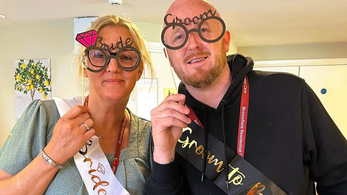 Residents celebrating with Bride to Be and Groom to Be sashes at Broomfield