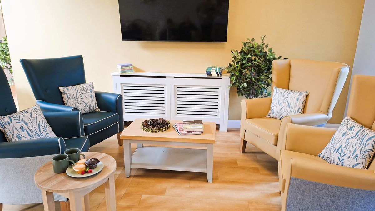 A bright, comfortable lounge at Broomfield Residential Care